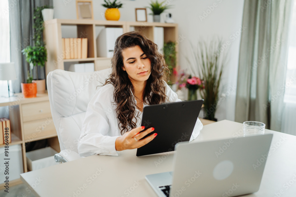 Young caucasian business woman working in office on laptop Young caucasian business woman working in office on laptop