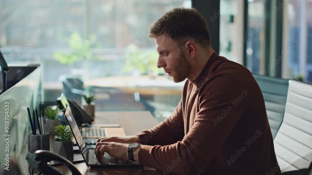 Unshaved businessman working laptop in office closeup. Manager typing computer