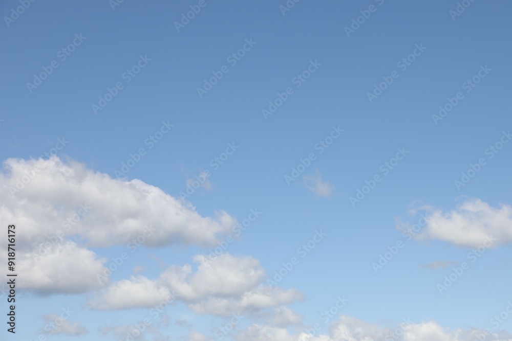 Picturesque view of blue sky with fluffy clouds Picturesque view of blue sky with fluffy clouds