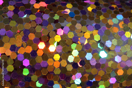 Gold-colored sparkling sequins abstract textured background