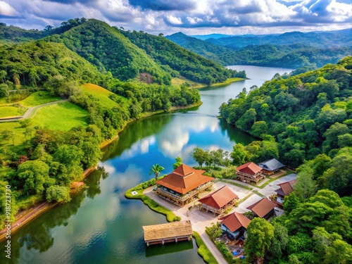 Serene Klapa Gading Kulon reservoir village in Banyumas, Indonesia becomes a popular tourist spot and fitness destination amidst its ongoing construction, surrounded by lush greenery. photo