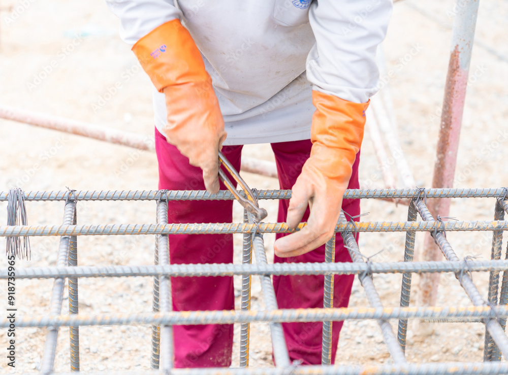 Worker use pliers bundle reinforcement deformed bar. Worker use pliers bundle reinforcement deformed bar.
