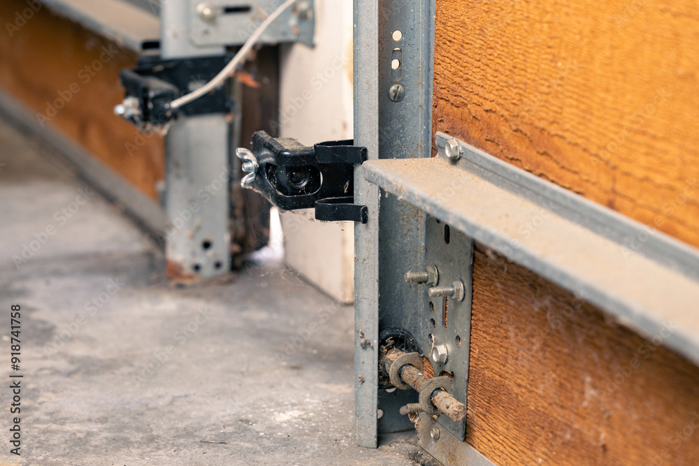 Garage door safety sensor on wooden door Garage door safety sensor on wooden door