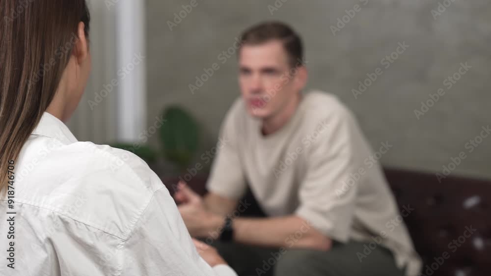 Psychological consultation gaining improvement on mental problem, young patient doing therapy session while psychiatrist making diagnostic on mental illness. Mental treatment session. Adit Psychological consultation gaining improvement on mental problem, young patient doing therapy session while psychiatrist making diagnostic on mental illness. Mental treatment session. Adit