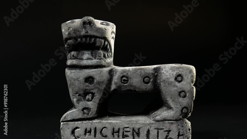 Mayan jaguar sculpture on black background