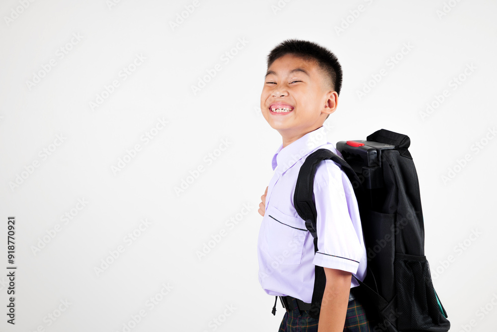 Portrait smile Asian little boy primary posing with schoolbag phone studio shot isolated white background, happy cute man kid wear school uniform and backpack learn new things, back to school concept Portrait smile Asian little boy primary posing with schoolbag phone studio shot isolated white background, happy cute man kid wear school uniform and backpack learn new things, back to school concept