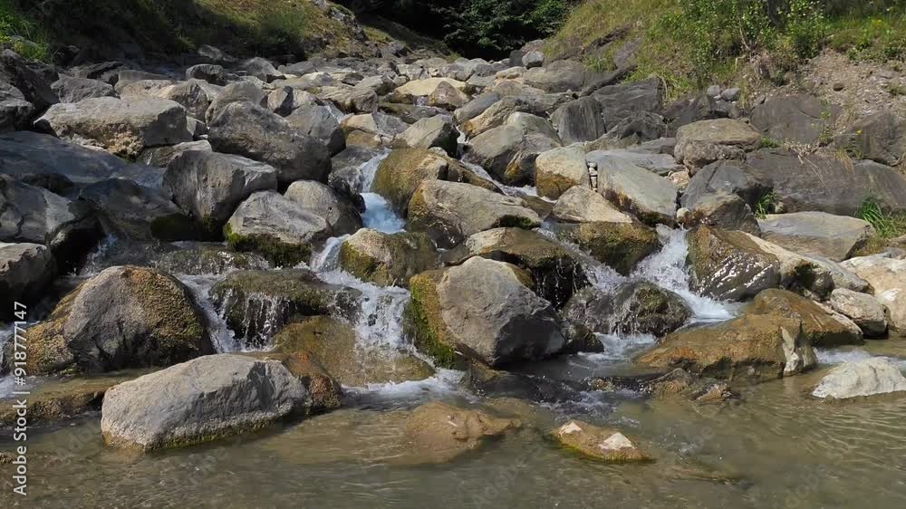 Water flowing in the river Weesen, Walensee, Glarus, Switzerland Water flowing in the river Weesen, Walensee, Glarus, Switzerland