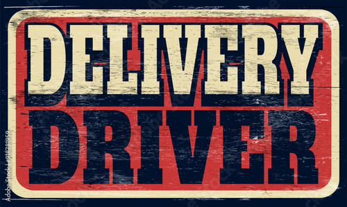 Aged and worn delivery driver sign on wood