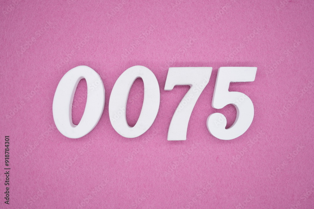 The numbers are made of white painted wood. Laying on the floor was pink paper. The numbers are made of white painted wood. Laying on the floor was pink paper.