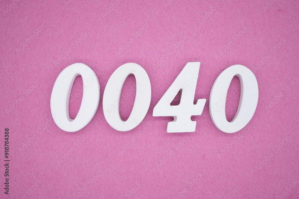 The numbers are made of white painted wood. Laying on the floor was pink paper.
