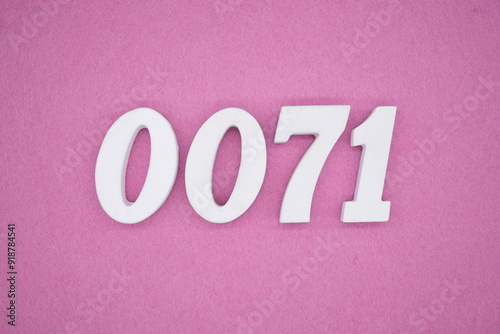 The numbers are made of white painted wood. Laying on the floor was pink paper.