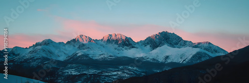 Majestic mountain range illuminated by sunrise