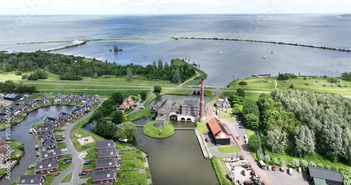 Historic steam pumping station, Stoomgemaal De Vier Noorder Koggen, Medemblik, The Netherlands. Aerial drone video. Dutch waterworks. photo