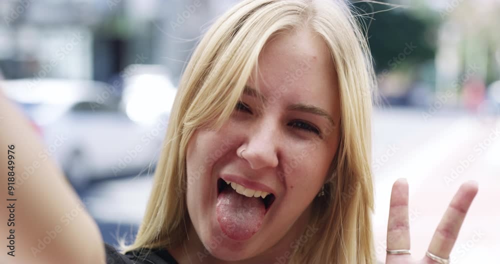 Woman, video call and smile in city, wave hello or travel, holiday or outdoor in street with tongue. Influencer girl, live stream and peace sign on road, air kiss or excited face to show town on vlog