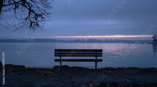 Germany BadenWurttemberg Radolfzell Empty park bench on shore of Lake Constance at dusk : Generative AI