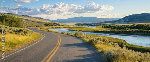 Winding Road Through a Scenic Valley with a River