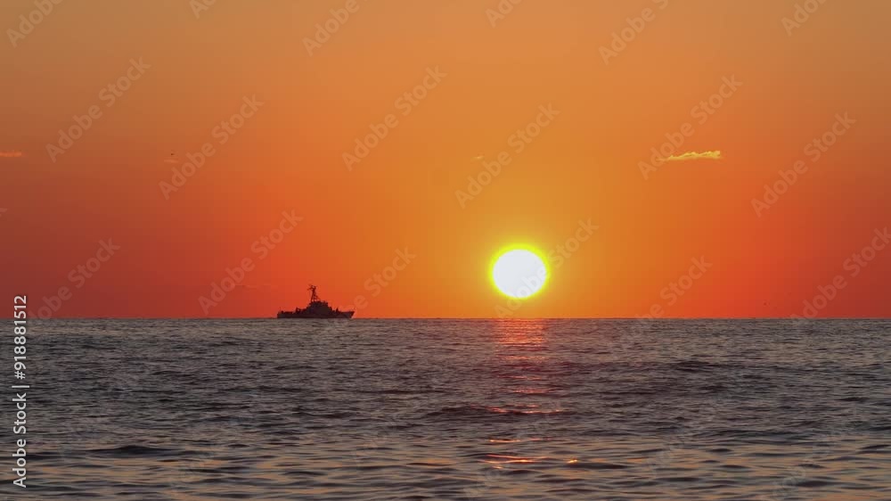 Silhouette of Ship on the Horizon with Vibrant Sunset Silhouette of Ship on the Horizon with Vibrant Sunset