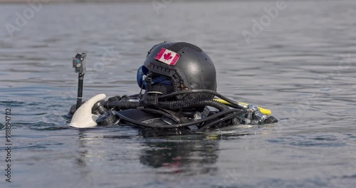 Canadian military scuba diver in water with camera