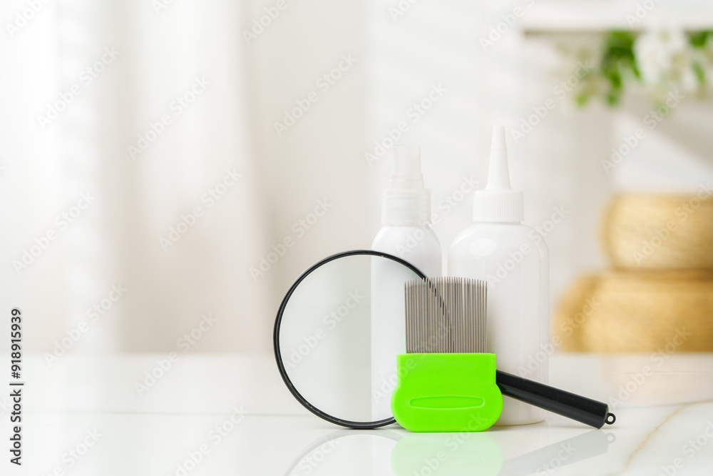 Green Comb on a Countertop with Lice Treatment Products Green Comb on a Countertop with Lice Treatment Products