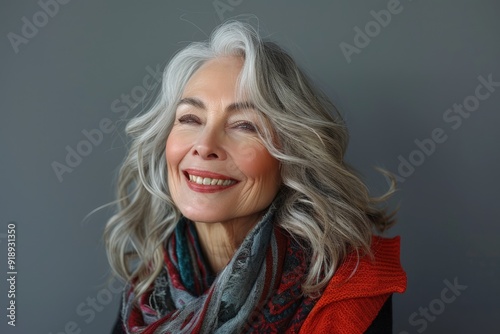 A charming older woman with grey hair, smiling with a gentle and pleasant demeanor