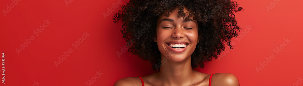 Smiling woman in red bikini top, standing against a red background, joyful and vibrant Smiling woman in red bikini top, standing against a red background, joyful and vibrant