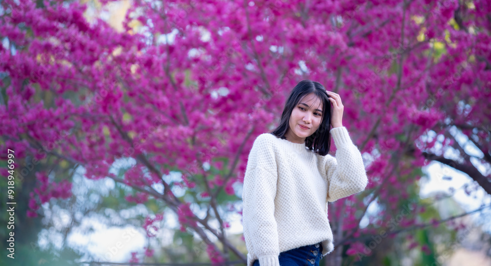 Beautiful asian woman relax in Cherry blossom flower field Beautiful asian woman relax in Cherry blossom flower field