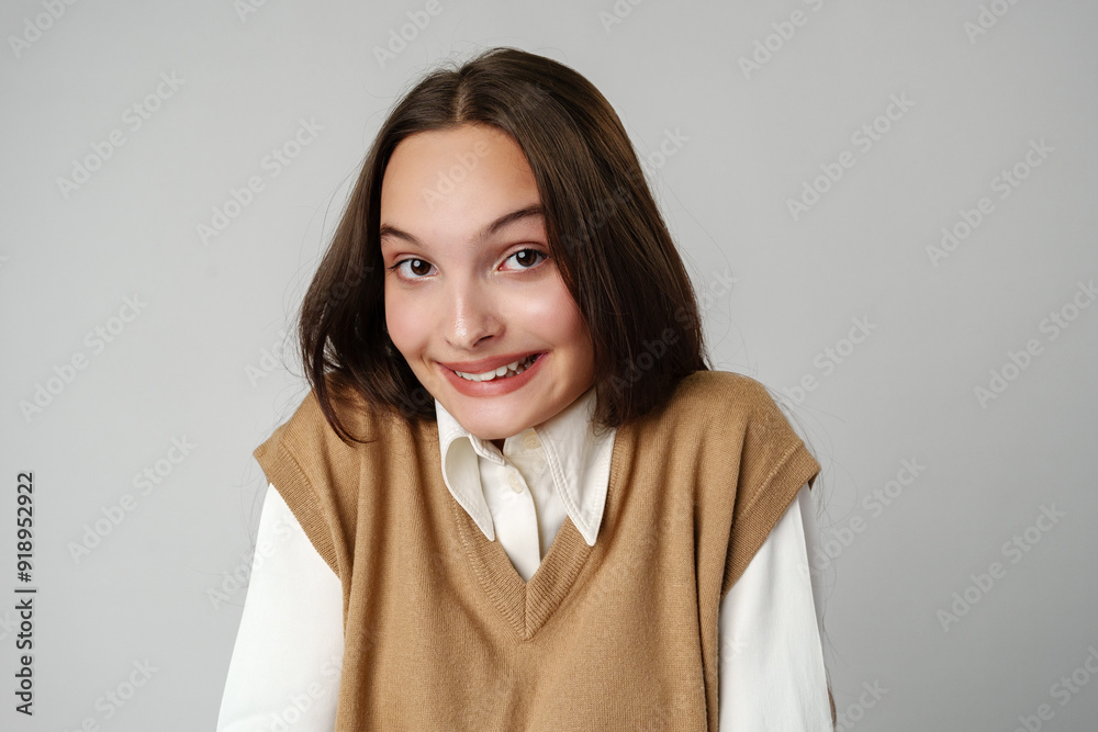 Photo of young shy adorable lady hold hands against gray background