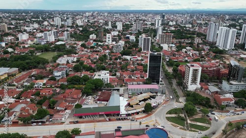 City aerial orbits vehicles in traffic roundabout, Santa Cruz Bolivia photo