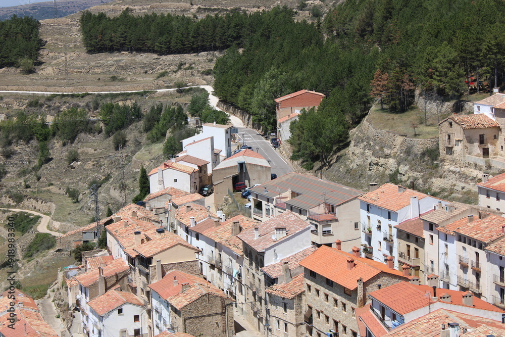 Fototapeta premium Ares del Maestre, a medieval village in the Province of Castellón, Spain, with a stone castle in ruins on a hilltop