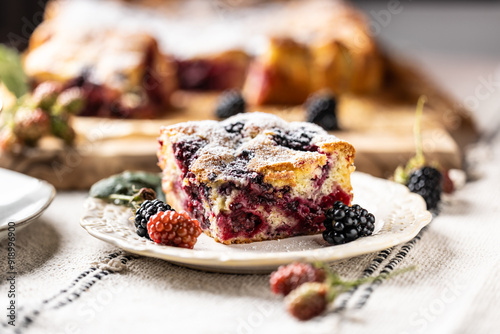 Fresh and hot blackberry cake made of blackberries, flour and eggs. Vegan fruit sponge cake © weyo