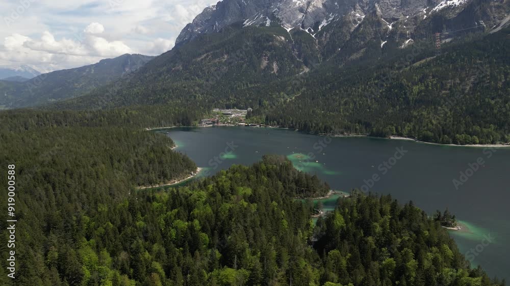 aerial drone view of the beautiful Lake Eibsee at the base of the Zugspitze mountain in the Bavarian Alps by Garmisch-Partenkirchen, Germany aerial drone view of the beautiful Lake Eibsee at the base of the Zugspitze mountain in the Bavarian Alps by Garmisch-Partenkirchen, Germany