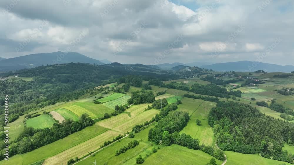 Fertile farmland and lush pastures of Polish mountainside in summer panorama Fertile farmland and lush pastures of Polish mountainside in summer panorama
