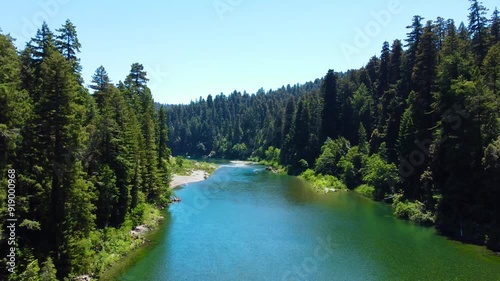 Emerald colored water and trees photo