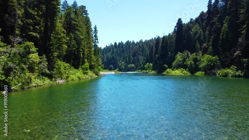 Drone over emerald colored rocky water photo