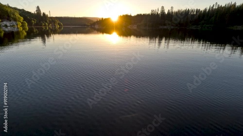 Ocean sunset mirrored over the water photo