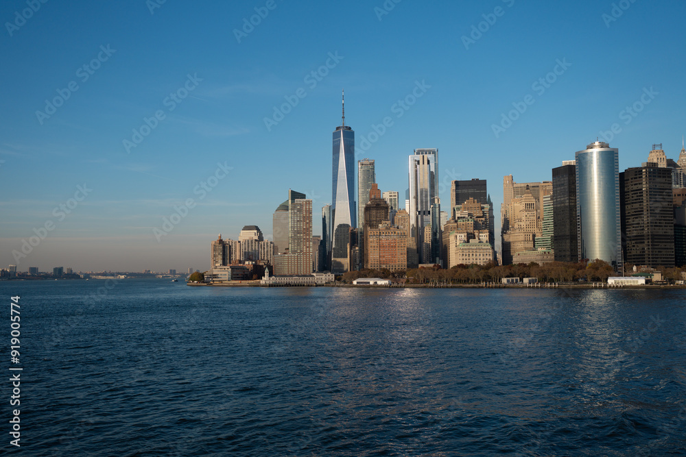 Manhattan's beautiful skyline, New York, United States. Panorama view of New York city skyline in Midtown Manhattan. USA NYC. American big city. Lower Manhattan skyline at sunny day. Manhattan's beautiful skyline, New York, United States. Panorama view of New York city skyline in Midtown Manhattan. USA NYC. American big city. Lower Manhattan skyline at sunny day.