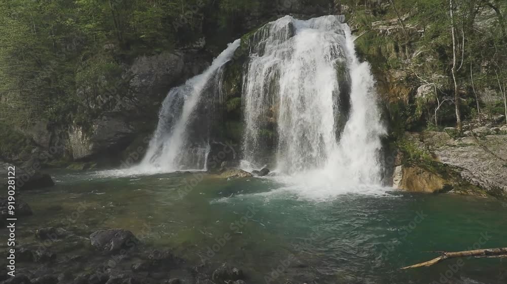 Bovec, Slovenia. Virje waterfalls. Nature trail crystal clear, turquoise water. easy trekking, nature experience, wood path. Waterfalls inside a forest, long photographic exposure, power of nature. Bovec, Slovenia. Virje waterfalls. Nature trail crystal clear, turquoise water. easy trekking, nature experience, wood path. Waterfalls inside a forest, long photographic exposure, power of nature.
