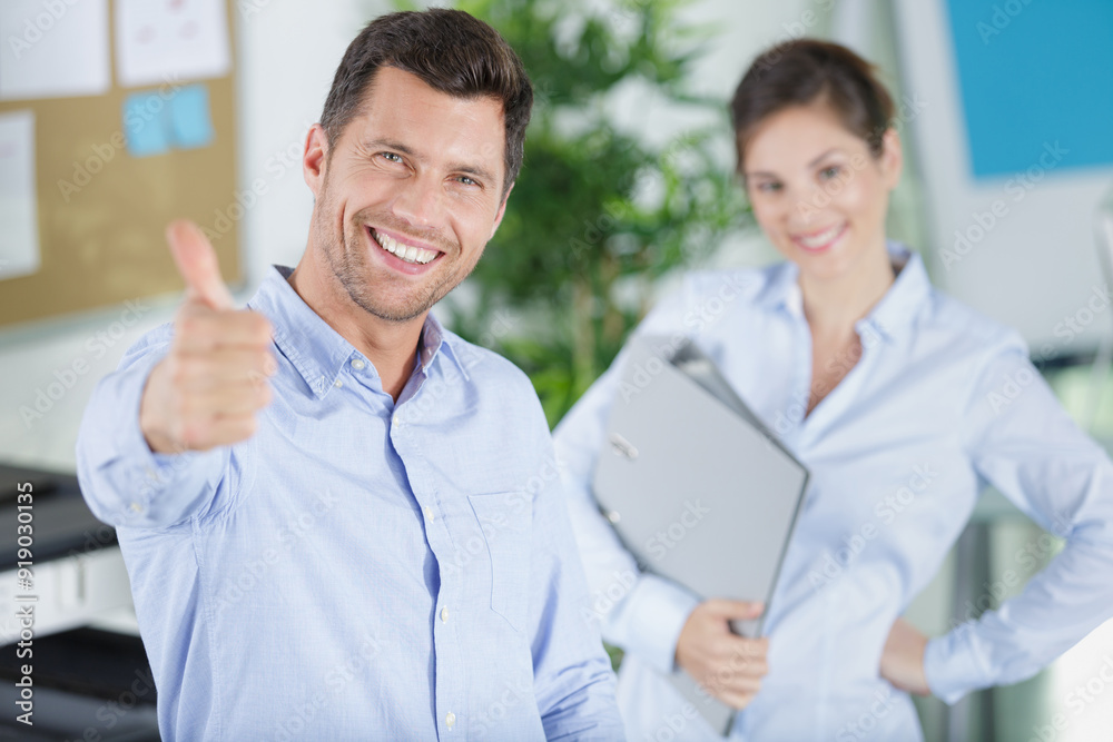 portrait of a bearded man and a woman in office portrait of a bearded man and a woman in office