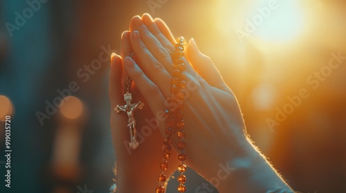 Close up Christian praying hands with rosary beads