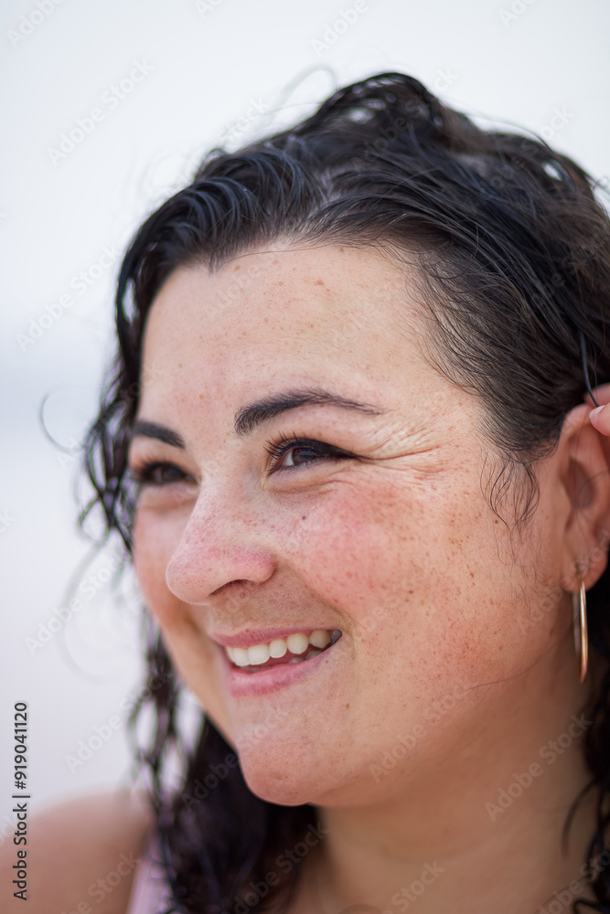 Fototapeta premium Happy curvy woman with wet hair