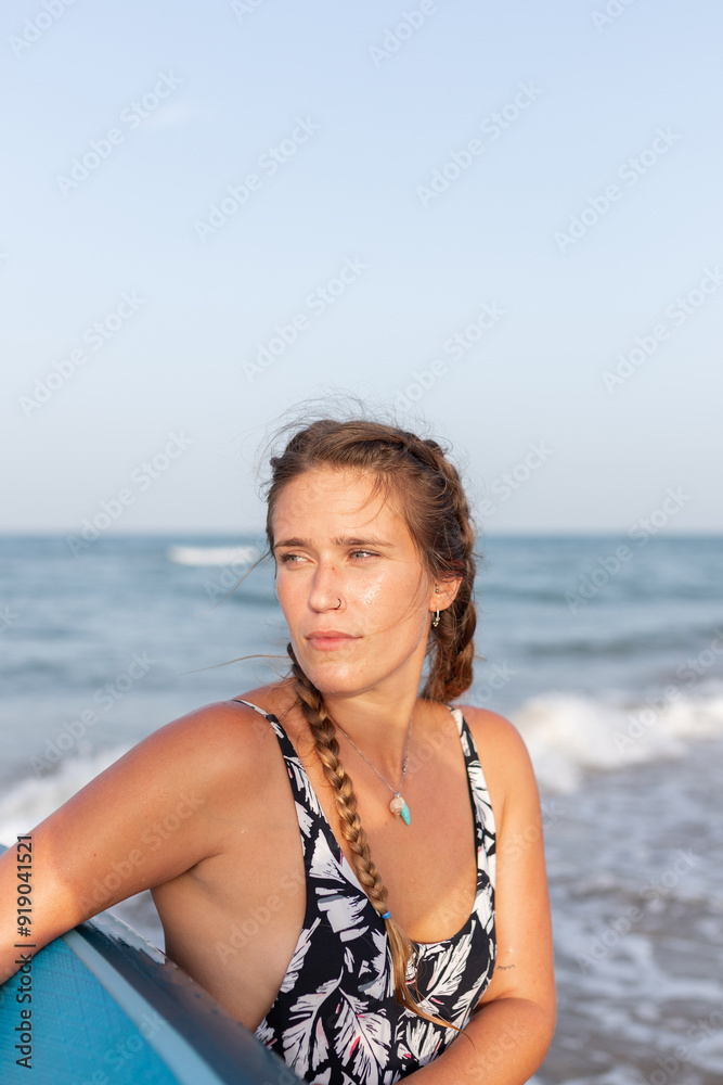 Woman with paddleboard near sea Woman with paddleboard near sea