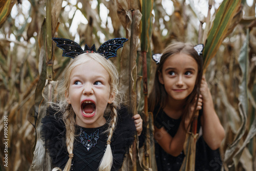 Girl holding crop and screaming in agricultural field