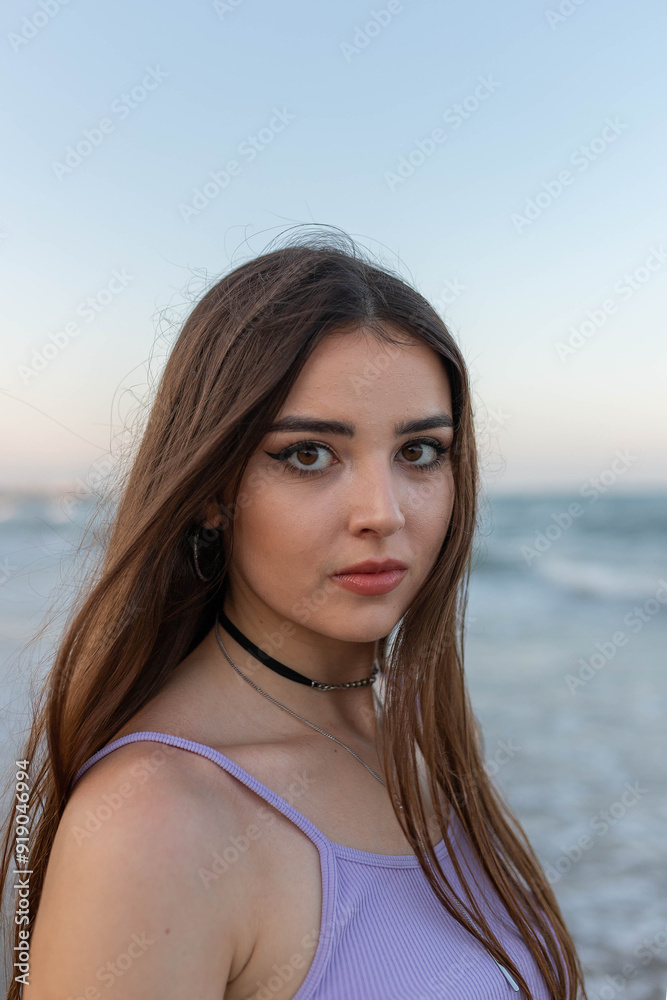 Young woman standing near sea Young woman standing near sea