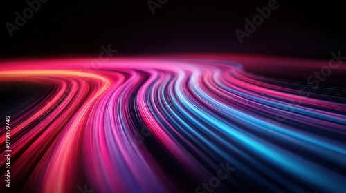 A captivating display of vibrant pink and blue light trails in dynamic motion against a dark background, creating a sense of speed and fluidity in an abstract setting.