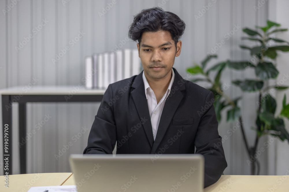 Focused Businessperson Working on Laptop