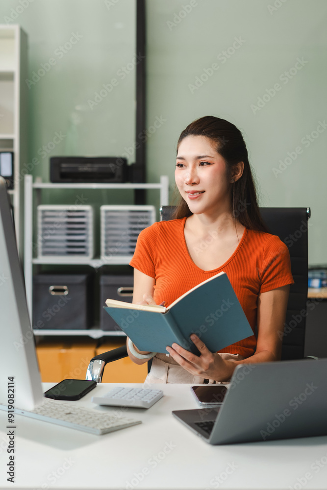 Business woman or financial data analysts working with smartphone and laptop computers and data graphs together. Plan to analyzing projects in the office. Business woman or financial data analysts working with smartphone and laptop computers and data graphs together. Plan to analyzing projects in the office.