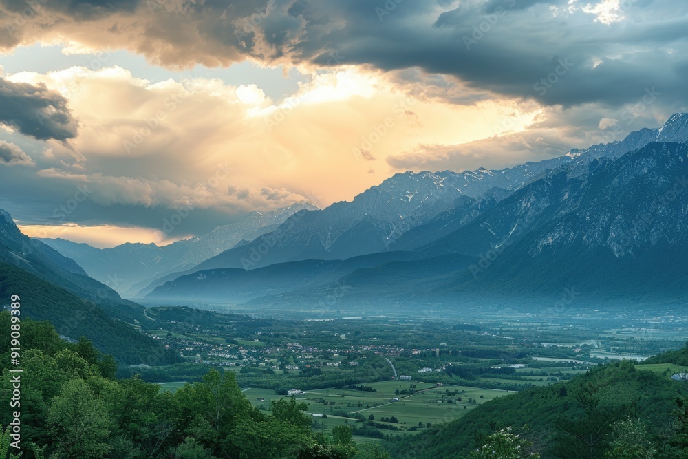 Obraz premium A scenic view of a valley with mountains in the background, suitable for travel or outdoor adventure use