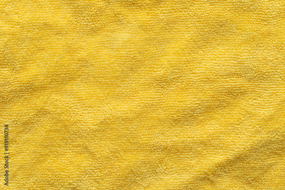 Clothing fabric yellow microfiber texture background, close up of cloth textile surface abstract. Clothing fabric yellow microfiber texture background, close up of cloth textile surface abstract.