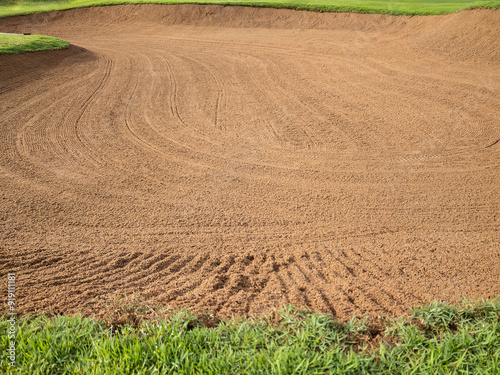 Golf Course Sand Pit Bunkers, green grass surrounding the beautiful sand holes is one of the most challenging obstacles for golfers and adds to the beauty of the golf course.