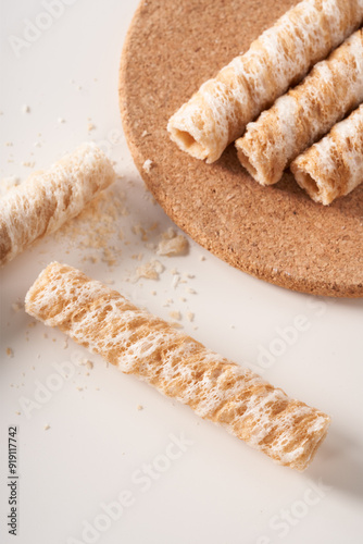Crispy and delicious coconut crispy egg roll snack close up on white background